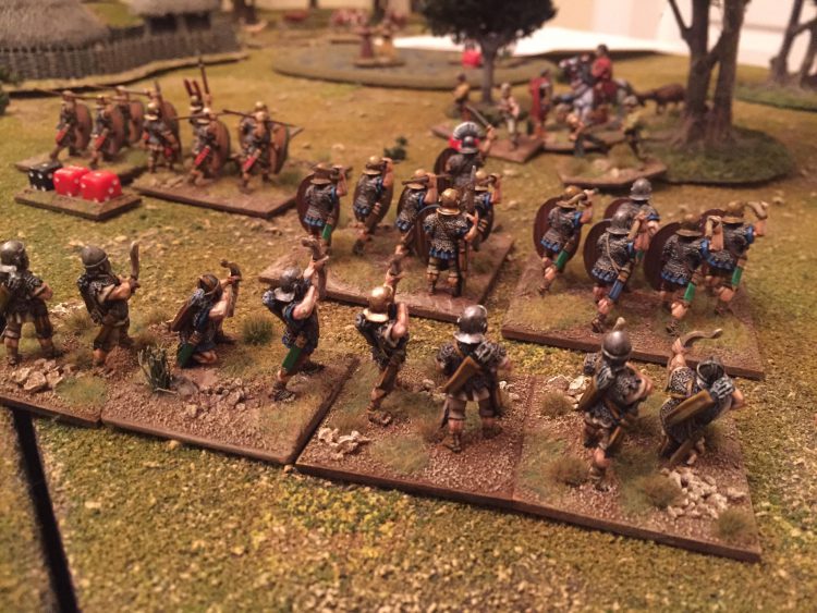 Roman archers shoot over legionaries