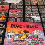 Bloc by Bloc rulebook and liberated city tile