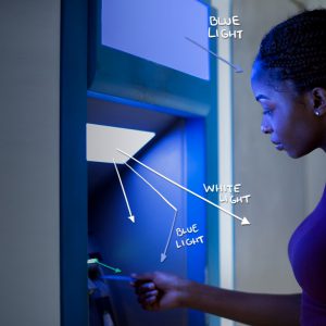 Woman withdrawing money from a cash machine