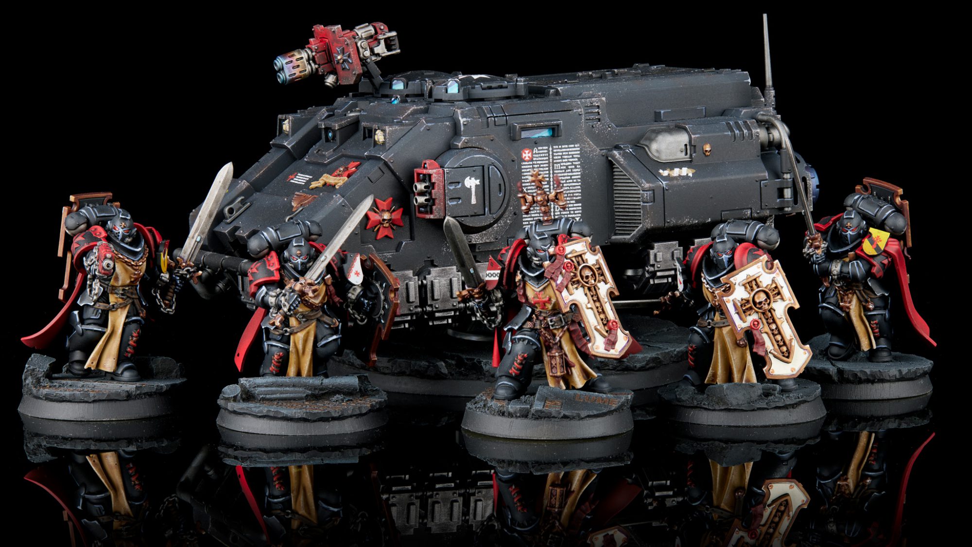 Black Templar Bladeguard Veterans standing in front of an Impulsor armed with a multi-melta