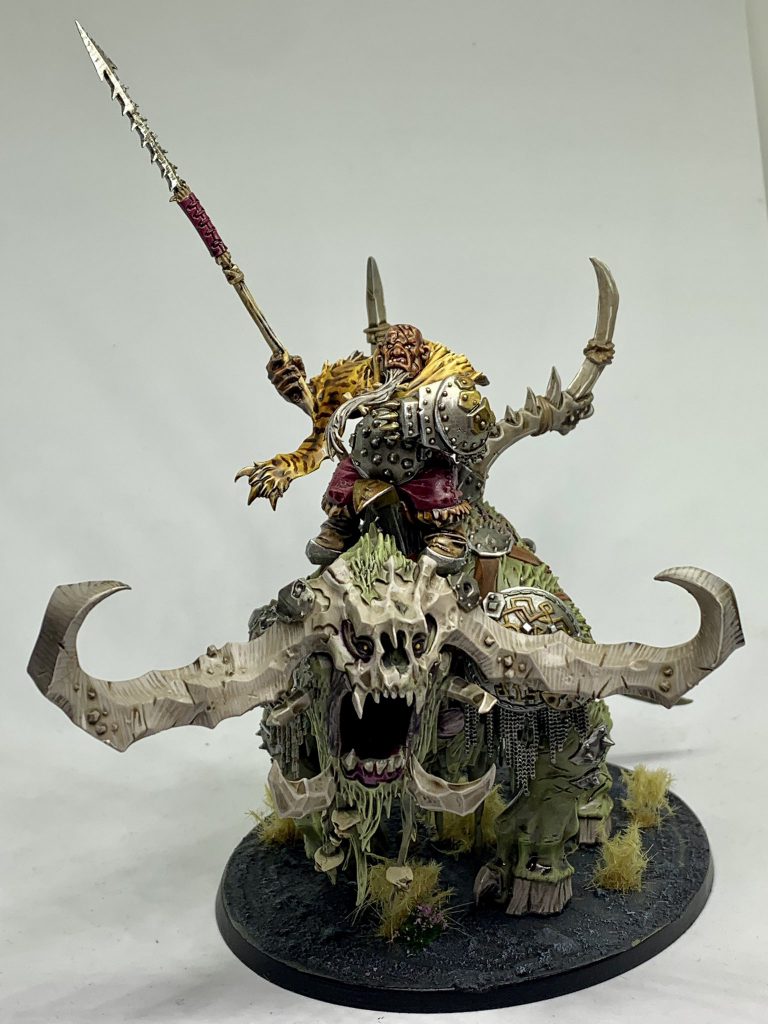Frostlord on Stonehorn from Games Workshop. An ogre riding atop a mighty moss green, ivory horned beast.