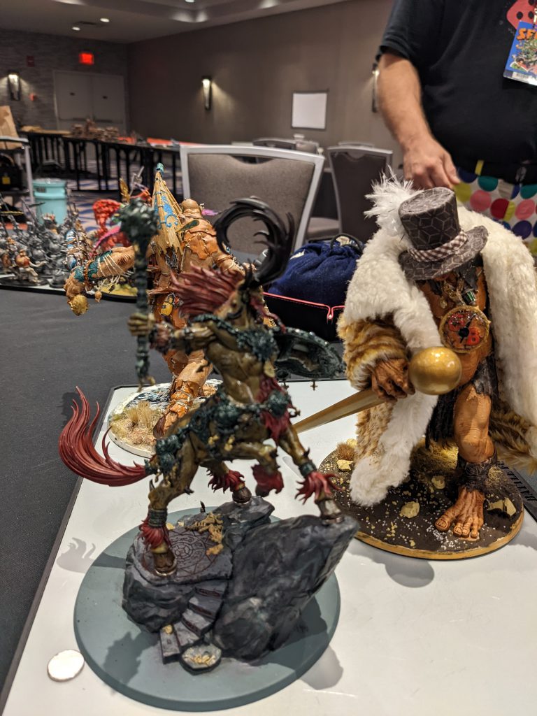 Kragnos and a Mega Gargent with staff, hat, and coat