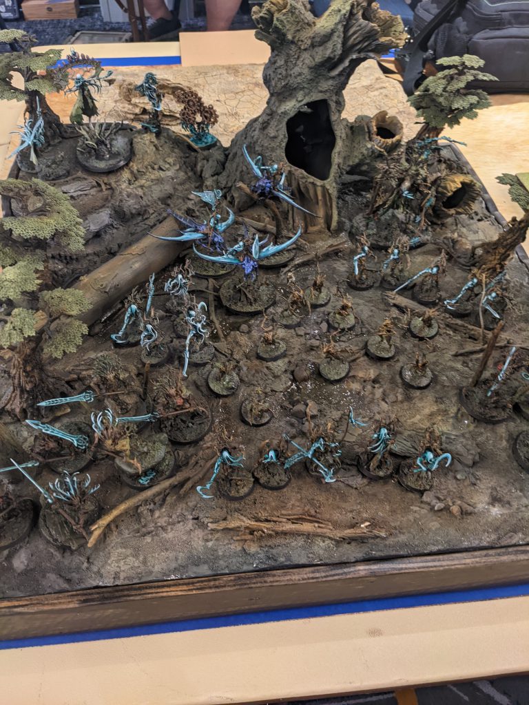 Sylvaneth army on display board with a hollow tree