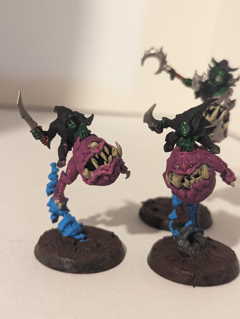 Three purple squig hoppers