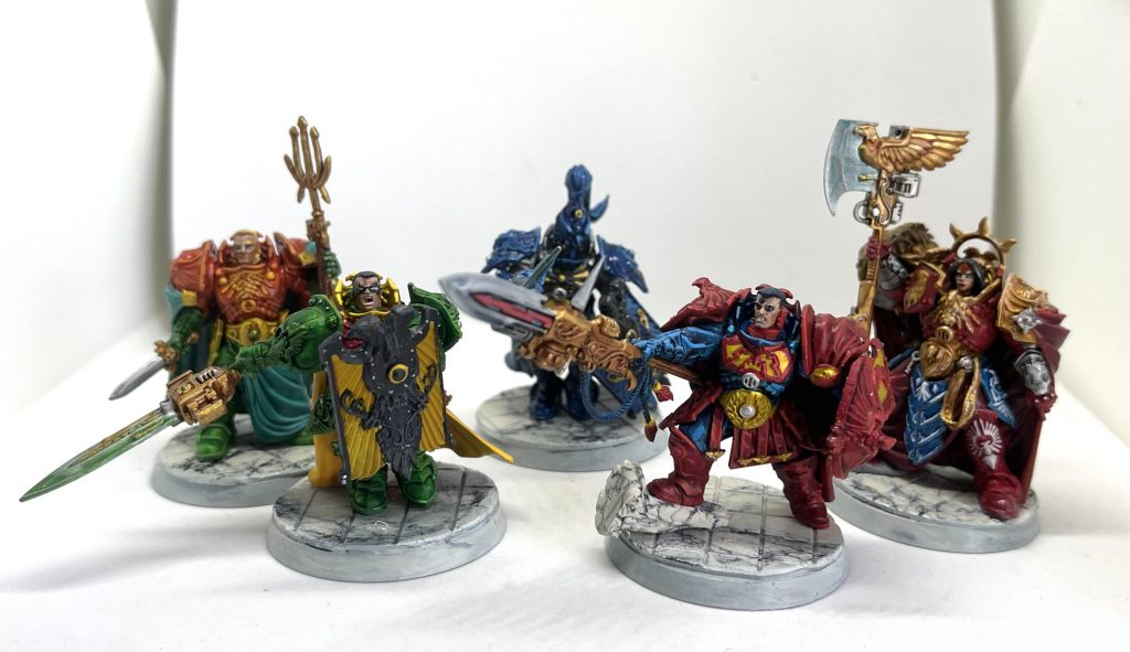 Five very colorful Custodes