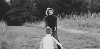 Black and white photograph of Amber Cook, reaching for her son James, from her GFM campaign page.