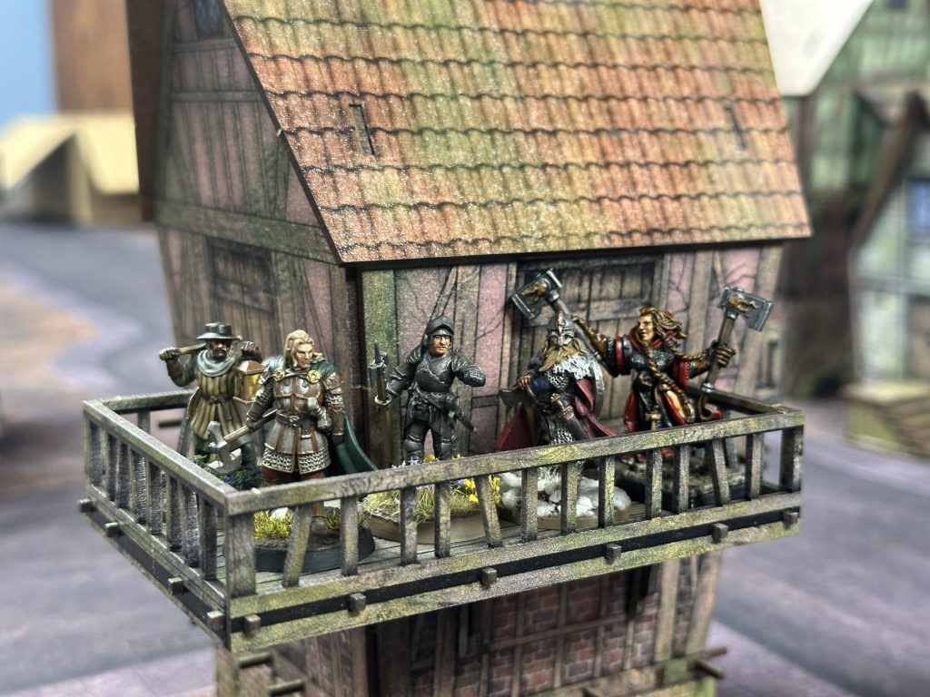Five 28mm figures on a porch